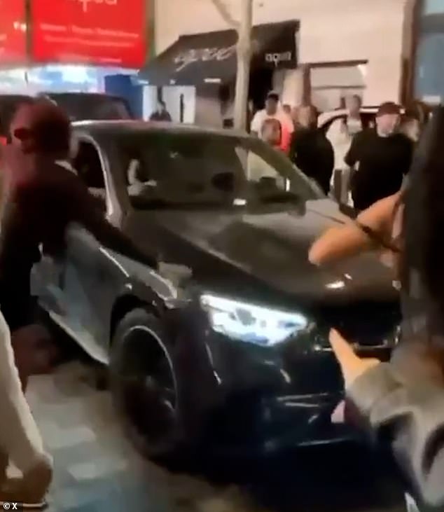 Car plows into pedestrians on Oxford Street, leaving one pinned under wreckage