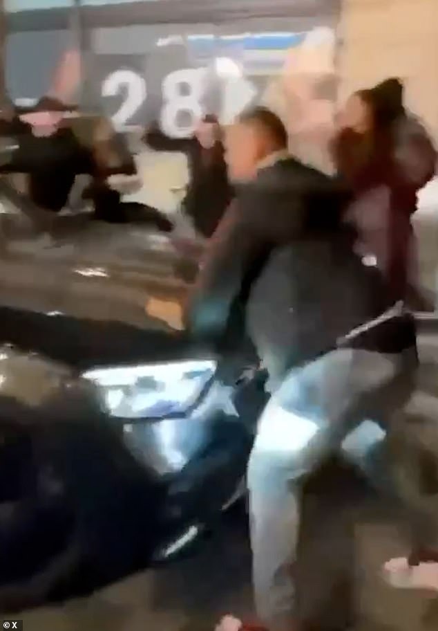 Car plows into pedestrians on Oxford Street, leaving one pinned under wreckage