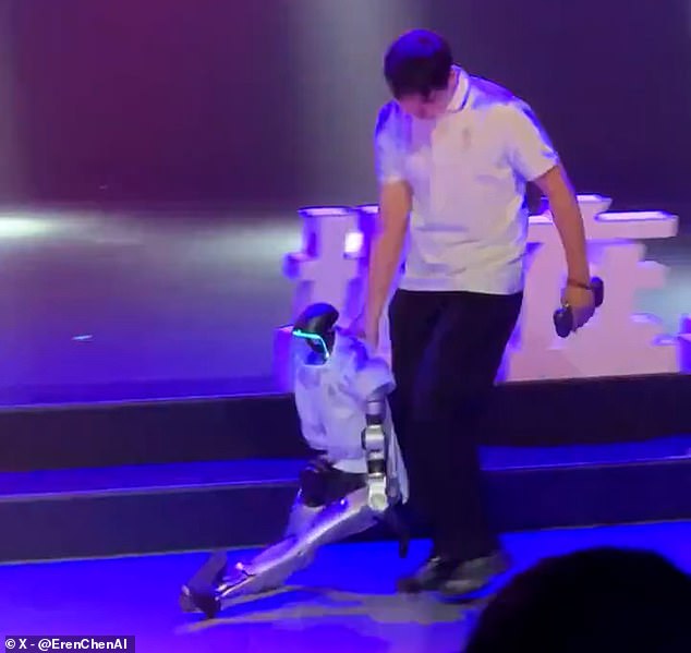 Humanoid robot stumbles over stage step during public dance performance.